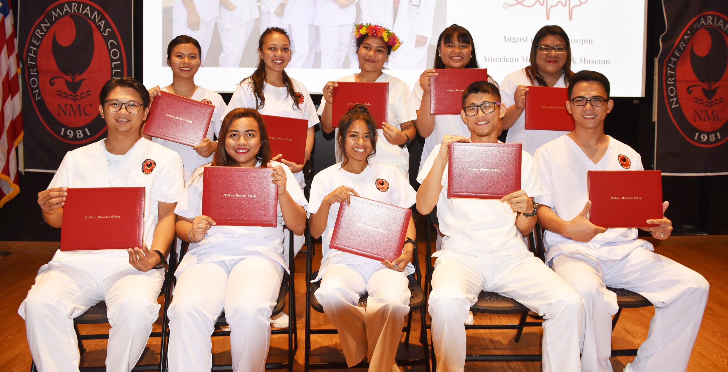 Nursing Students pose for a photo holding their certificates.