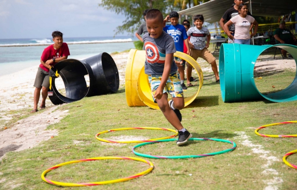 Rota Campers complete an obstacle course.