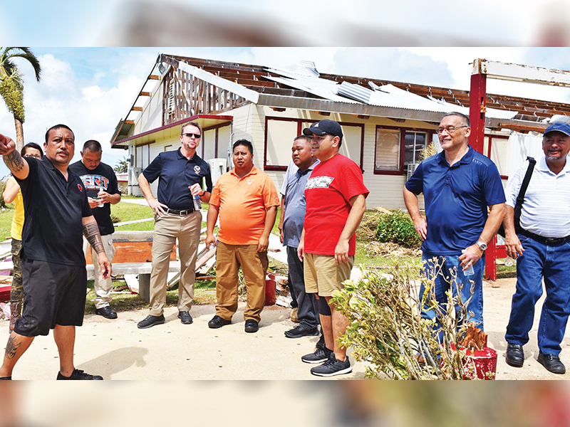 File photo shows Gov. Ralph DLG Torres, in orange shirt, leading other officials in a tour of the damage that the Northern Marianas College sustained after Super Typhoon Yutu hit Saipan and Tinian in October 2018. (CONTRIBUTED PHOTO)