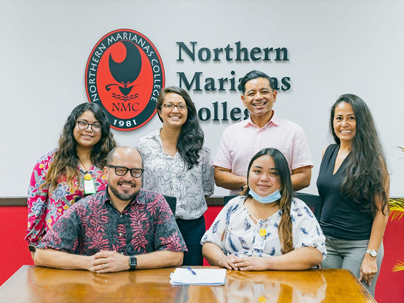 The Commonwealth Healthcare Corp. and Northern Marianas College signed a partnership agreement on July 6, 2021. Standing, from left: Brianna Fajardo, CHCC community outreach specialist; Patricia Coleman, NMC interim dean; Frankie Eliptico, NMC vice president; Tayna Belyeu-Camacho, certified cessation facilitator. Seated: Dr. Galvin Deleon Guerrero, NMC president; and Jolanie Tenorio, CHCC project assistant.