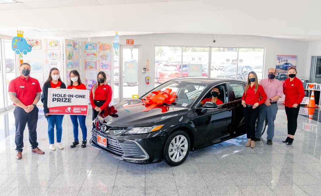 Atkins Kroll Saipan has announced that it is offering a brand new 2022 Toyota Camry as a hole-in-one prize in the upcoming 17th Annual NMC Foundation Golf Tournament. In photo is NMC President Galvin Deleon Guerrero with AK Toyota sales representatives and NMC students.