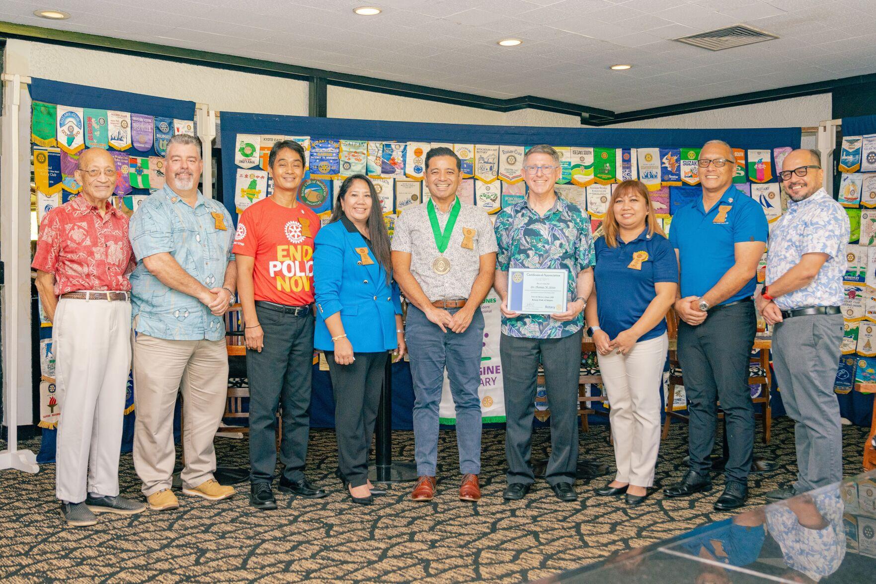 Frankie Eliptico, Northern Marianas College Vice President for Administration and Advancement (center), was awarded the University of Guam’s “Milåyan Presidenten” or The President’s Medal by UOG President Dr. Thomas W. Krise at the Saipan Rotary Club’s meeting on Tuesday, August 10, 2022. In photo with Eliptico from left are Rotarians Dave Sablan and Mario Valentino, Rotary Club President Wendell Posadas, Rotarian Joann Aquino, UOG President Dr. Thomas W. Krise, Rotarian Jessy Loomis, NMC Board of Regents Chairperson and Rotarian Charles V. Cepeda, and NMC President Galvin Deleon Guerrero, EdD.