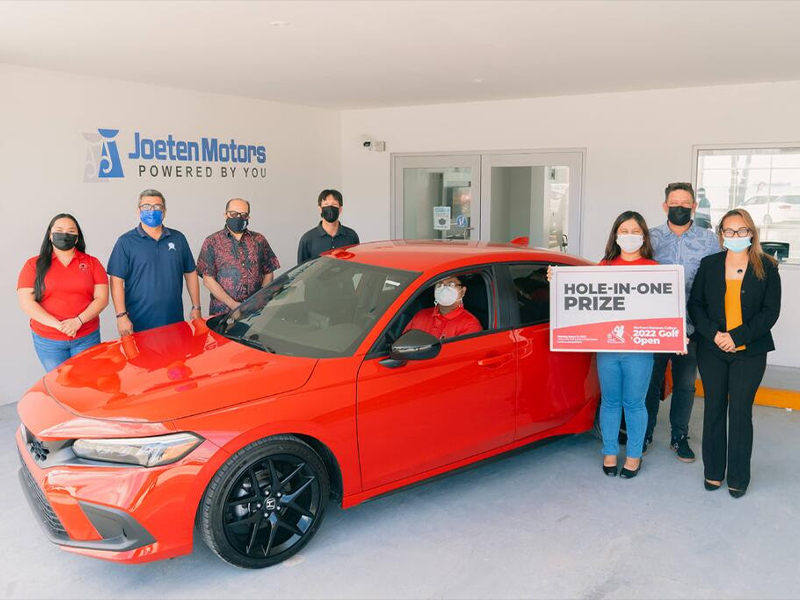 Joeten Motors has announced that it is offering a brand new 2022 Honda Civic Sport Hatchback as a hole-in-one prize in the upcoming 17th Annual NMC Foundation Golf Tournament. In this pre-pandemic photo are NMC students and employees along with NMC President Galvin Deleon Guerrero, EdD and Joeten Motors representatives Matthew Deets, Boss Alvarez, and Peter Tenorio.