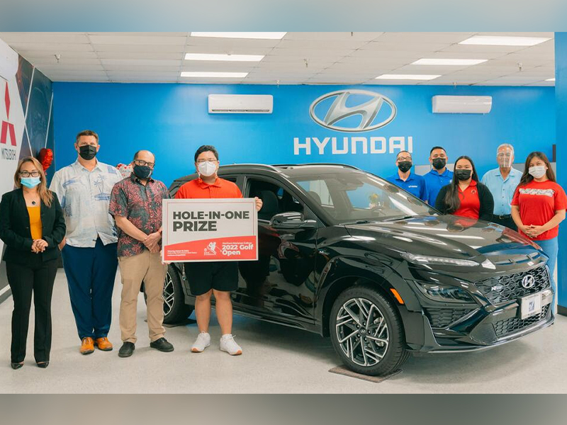 Triple J Motors has announced that it is offering a brand new 2022 Hyundai Kona N-Line as a hole-in-one prize in the upcoming 17th Annual NMC Foundation Golf Tournament. In photo are NMC students and employees along with NMC President Galvin Deleon Guerrero, EdD, Triple J Motors General Manager Sean Ficke, and Triple J Motors representatives.