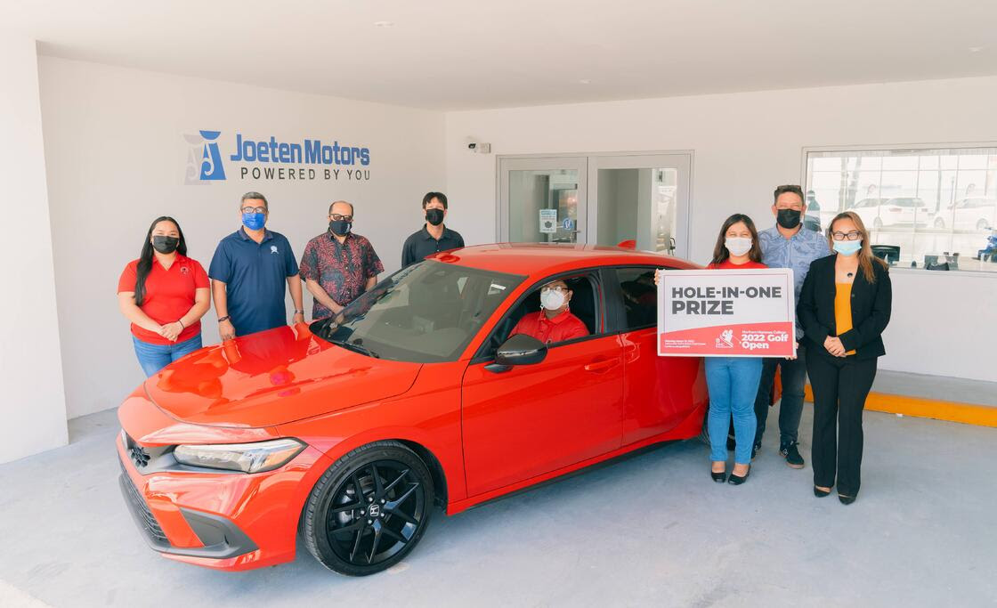 Joeten Motors has announced that it is offering a brand new 2022 Honda Civic Sport Hatchback as a hole-in-one prize in the upcoming 17th Annual NMC Foundation Golf Tournament. In this pre-pandemic photo are NMC students and employees along with NMC President Galvin Deleon Guerrero, EdD and Joeten Motors representatives Matthew Deets, Boss Alvarez, and Peter Tenorio.