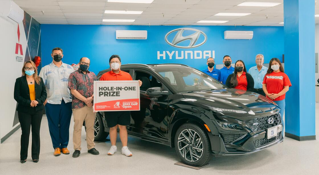Triple J Motors has announced that it is offering a brand new 2022 Hyundai Kona N-Line as a hole-in-one prize in the upcoming 17th Annual NMC Foundation Golf Tournament. In photo are NMC students and employees along with NMC President Galvin Deleon Guerrero, EdD, Triple J Motors General Manager Sean Ficke, and Triple J Motors representatives.