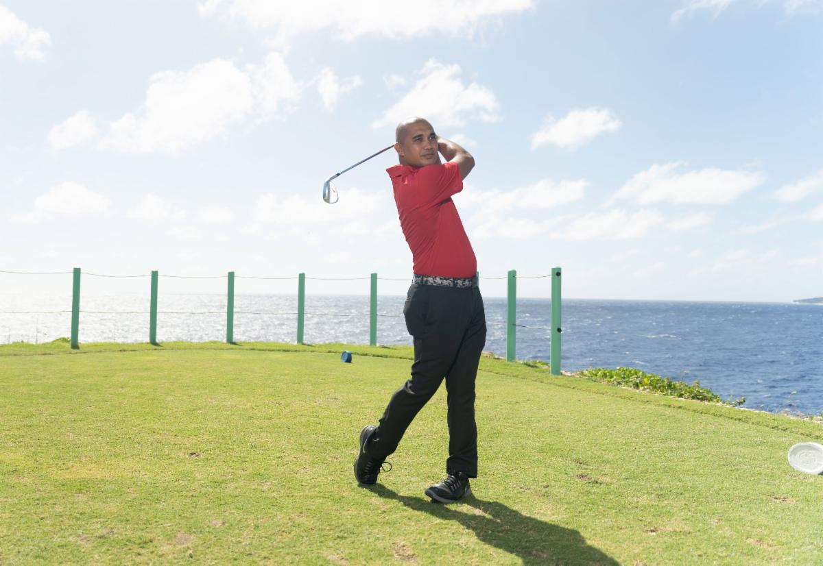 Franco Santos tees off on the East Course of the LaoLao Bay Golf and Resort. 